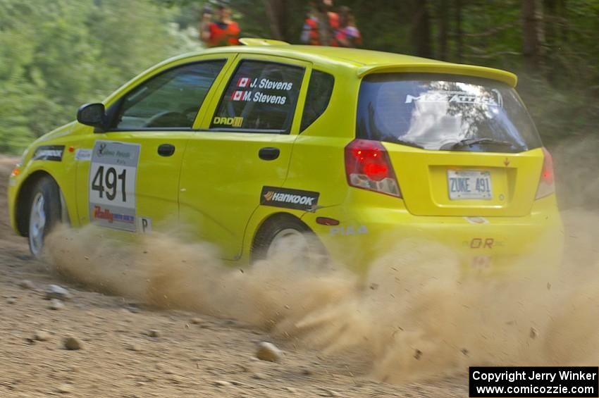 The Suzuki Swift of Jim Stevens / Marianne Stevens heads into an uphill right on SS12.