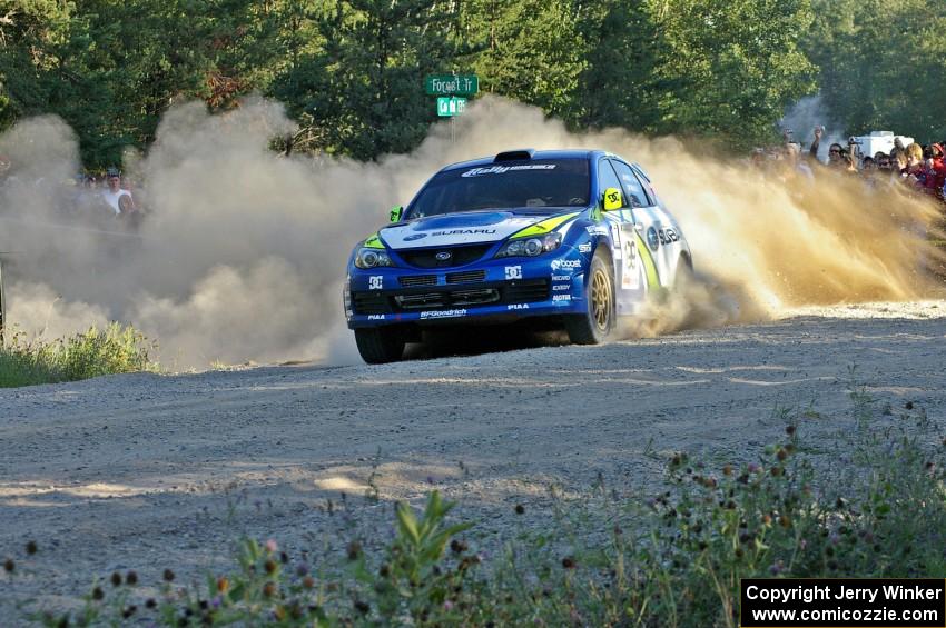 Travis Pastrana / Derek Ringer blast past the spectator area on SS13 in their Subaru WRX STi.