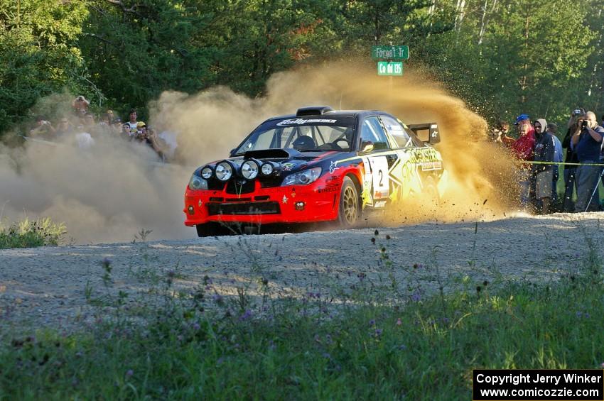 Andy Pinker / Robbie Durant sling gravel at the spectator point on SS13 in their Subaru WRX STi.