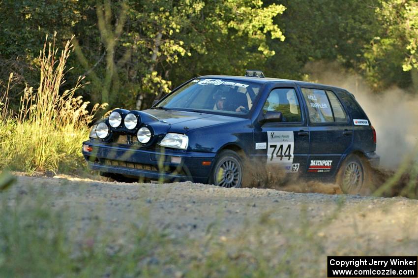 Paul Koll / Matt Wappler exit onto the county road on SS13 in their VW Golf.