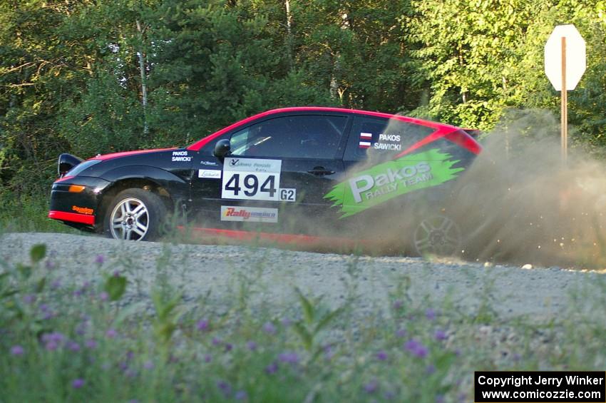 Roman Pakos / Maciej Sawicki exit onto the county road at the spectator point on SS13 in their Ford Focus SVT.