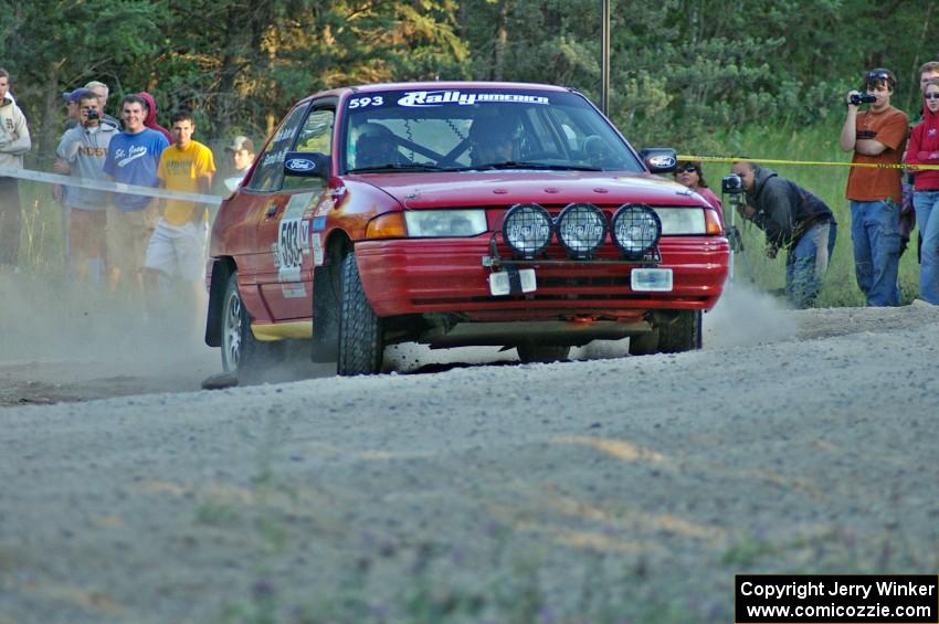 Gerardo Pin / John Butler at the spectator point on SS13 in their Ford Escort GT.