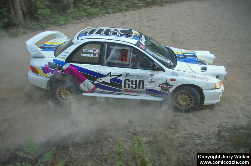 The Kenny Bartram / Dennis Hotson Subaru Impreza drifts through a right-hander on SS15.