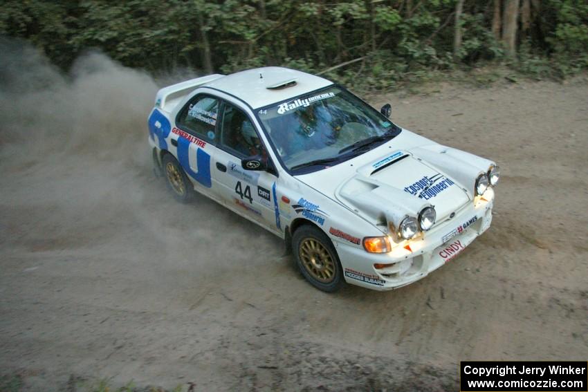 Henry Krolikowski / Cindy Krolikowski drift their Subaru Impreza through a right-hander on SS15.