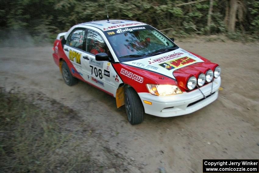 Jan Zedril / Jody Zedril prepare for a right-hander on SS15 in their Mitsubishi Lancer ES.