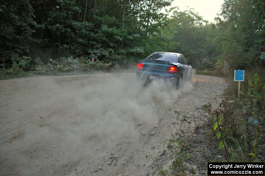 Chris Greenhouse / Don DeRose exit out of a right-hander on SS15 in their Plymouth Neon.