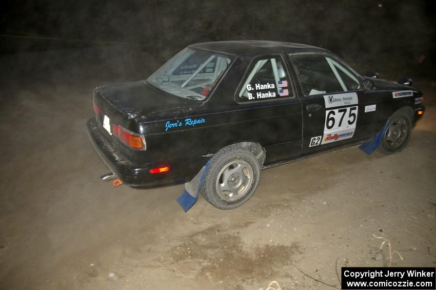 Ben Hanka / Greg Hanka cruise through a 90-right on SS15 in their Nissan Sentra SE-R just prior to the stage being scrubbed.