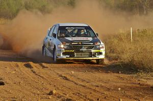 Andi Mancin / Maciej Wislawski drift their Mitsubishi Evo 9 out of a sweeper on the practice stage.