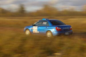 Slawomir Balda / Janusz Topor accelerate on a long straight on the practice stage in their Subaru WRX.