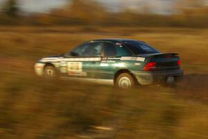 Chris Greenhouse / Don DeRose at speed down a straight on the practice stage in their Plymouth Neon.