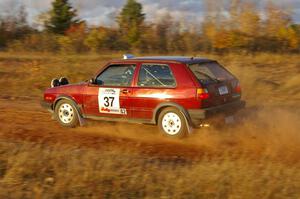 Billy Mann / Josh VanDenHeuvel at speed in their VW GTI on the practice stage.