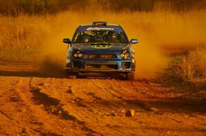 Heath Nunnemacher / Travis Hanson drift their Subaru WRX out of a fast sweeper on the practice stage.