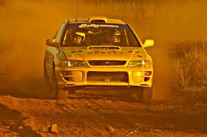 Kyle Sarasin / Mikael Johansson blast down a straight on the practice stage in their Subaru Impreza.