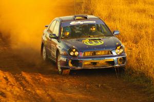 Heath Nunnemacher / Travis Hanson drift their Subaru WRX at a fast sweeper on the practice stage.