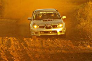 Piotr Wiktorczyk / Alan Dolan take a fast sweeper on the practice stage in their Subaru WRX STi.