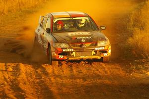 The Andrew Comrie-Picard / Marc Goldfarb Mitsubishi Lancer Evo 9 RS drifts through a sweeper on the practice stage.