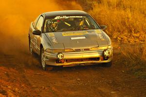 Spencer Prusi / Mike Amicangelo accelerate out of a sweeper in their Eagle Talon on the practice stage.