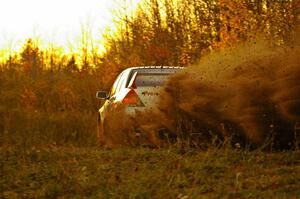 Arkadiusz Gruszka / Michal Chodan throw a plume of gravel on the practice stage in their Mitsubishi Lancer Evo 9.