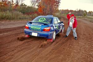 Charlie Cotterman releases the Heath Nunnemacher / Travis Hanson Subaru WRX on the practice stage.