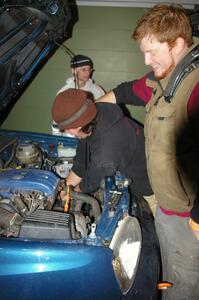Ben Slocum annoys Paul Koll while he switches out the transmission on his VW Golf. Matt Himes is in the background.(1)