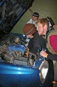 Ben Slocum annoys Paul Koll while he switches out the transmission on his VW Golf. Matt Himes is in the background.(2)