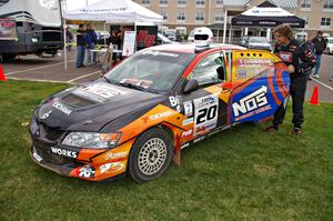 Andrew Comrie-Picard Mitsubishi prepares to climb into his Lancer Evo 9 RS that he shared with Marc Goldfarb at parc expose.