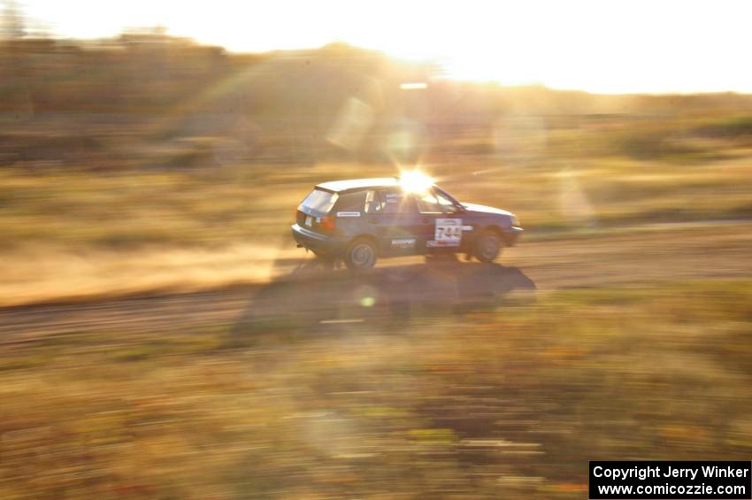 Paul Koll / Carl Seidel at speed on a straight on the practice stage in their VW Golf.