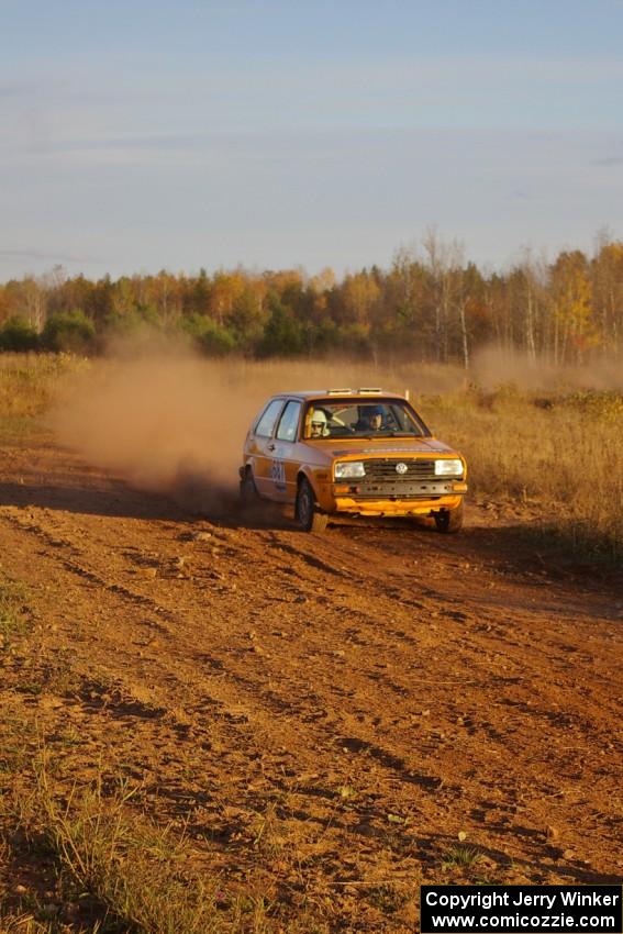 Chad Eixenberger / Jay Luikart at speed at the exit of a fast sweeper on the practice stage in their VW Golf.