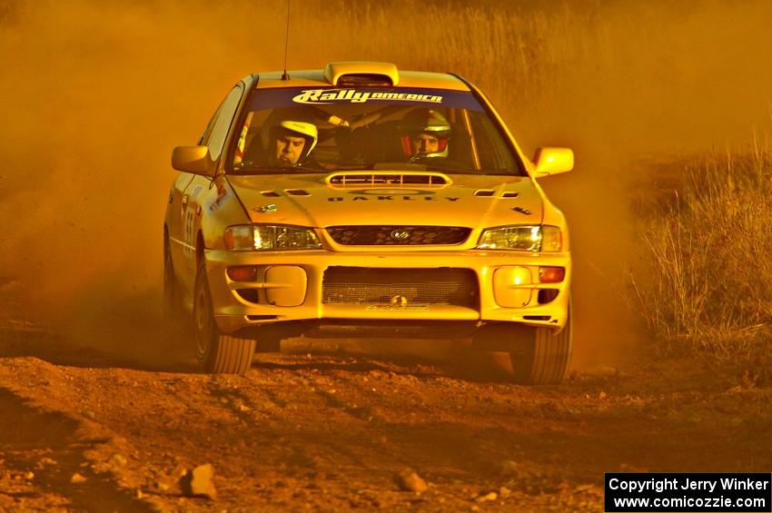 Kyle Sarasin / Mikael Johansson blast down a straight on the practice stage in their Subaru Impreza.