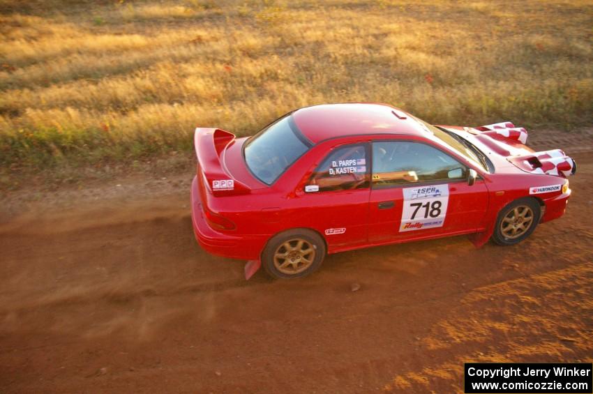 Dustin Kasten / Dave Parps at speed on the practice stage in their Subaru Impreza.