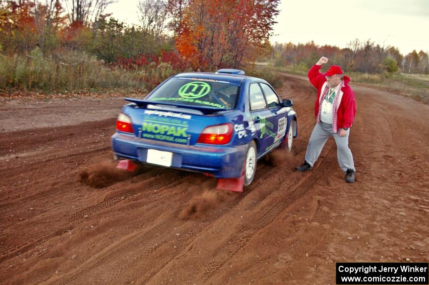 Charlie Cotterman releases the Heath Nunnemacher / Travis Hanson Subaru WRX on the practice stage.