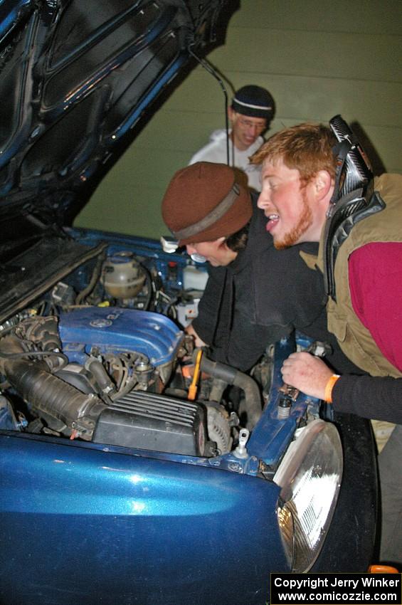 Ben Slocum annoys Paul Koll while he switches out the transmission on his VW Golf. Matt Himes is in the background.(2)