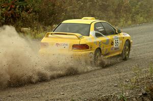 Kyle Sarasin / Mikael Johansson blast their Subaru Impreza out of a hard left at the spectator point on SS1.