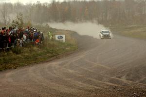 Andi Mancin / Maciej Wislawski at speed their Mitsubishi Evo 9 at the spectator point on SS1.