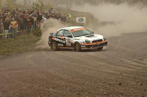 Pat Moro / Mike Rossey throw their Subaru WRX hard into a drift at the spectator point on SS1.