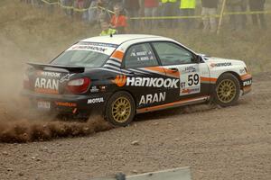 Pat Moro / Mike Rossey accelerate out of a left-hander at the spectator point on SS1 in their Subaru WRX.