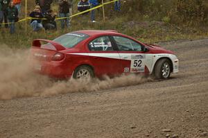 Doug Shepherd / Karen Wagner drift through a hard left on SS1 in their Dodge SRT-4.