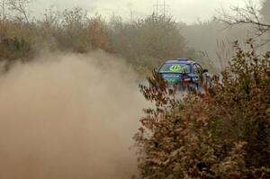 Heath Nunnemacher / Travis Hanson accelerate their Subaru WRX away from the spectator location on SS1.