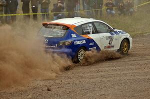 Eric Burmeister / Dave Shindle blast their Mazda Speed 3 out of the spectator corner on SS1.
