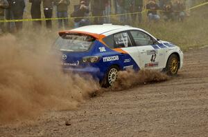 Eric Burmeister / Dave Shindle blast their Mazda Speed 3 out of the spectator corner on SS1.