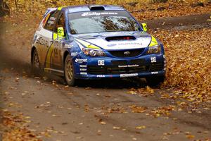 Travis Pastrana / John Buffum fly through a left sweeper at the end of Beacon Hill, SS2, in their Subaru WRX STi.