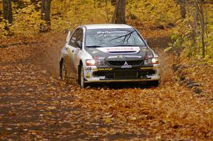 Andi Mancin / Maciej Wislawski drift their Mitsubishi Evo 9 through a sweeper on SS2, Beacon Hill.