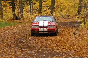 Mark Utecht / Rob Bohn take it easy on a slippery corner on SS2, Beacon Hill, in their Ford Mustang.