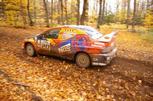 The Andrew Comrie-Picard / Marc Goldfarb Mitsubishi Lancer Evo 9 RS drifts through a sweeper near the finish of SS2.