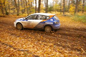 Eric Burmeister / Dave Shindle drift their Mazda Speed 3 through a sweeper on SS2, Beacon Hill.