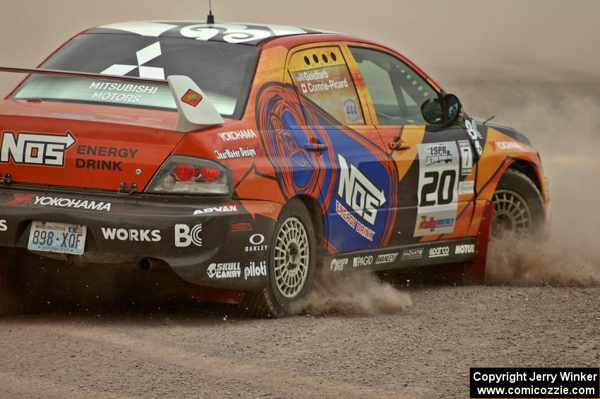 Andrew Comrie-Picard / Marc Goldfarb spin, stall and refire their Mitsubishi Lancer Evo 9 RS at the SS1 spectator point.