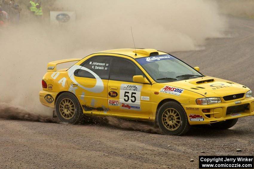 Kyle Sarasin / Mikael Johansson toss their Subaru Impreza into a hard left at the spectator point on SS1.