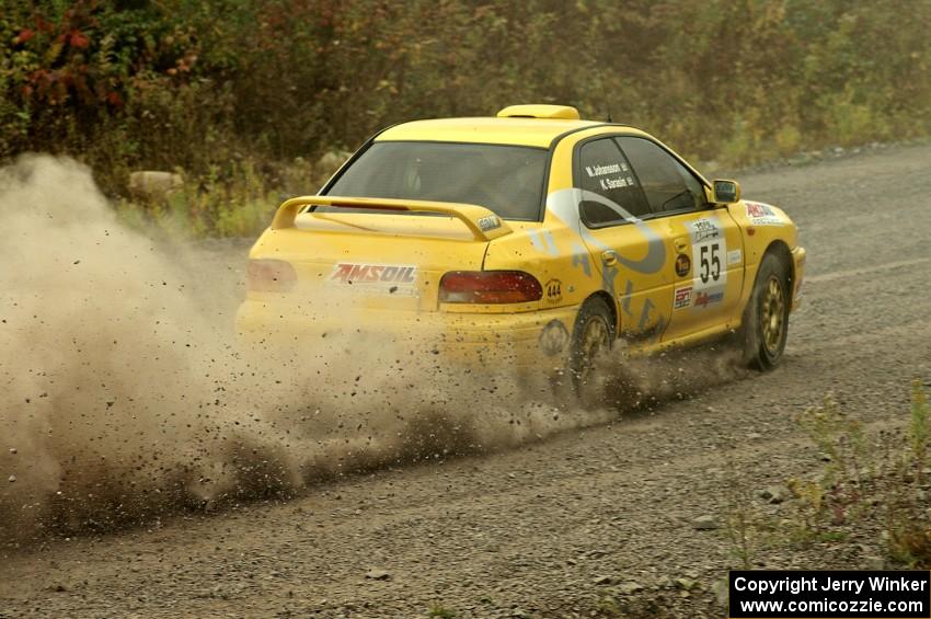 Kyle Sarasin / Mikael Johansson blast their Subaru Impreza out of a hard left at the spectator point on SS1.