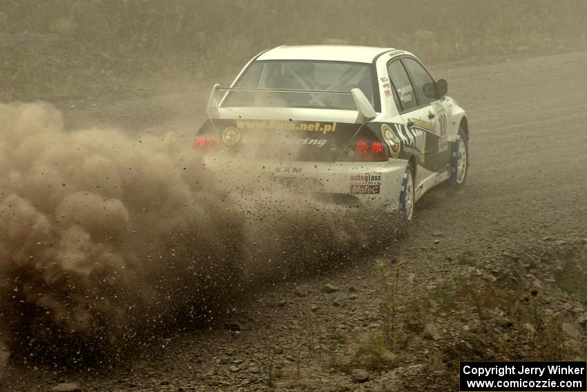 Andi Mancin / Maciej Wislawski power their Mitsubishi Evo 9 out of a 90-left on SS1.