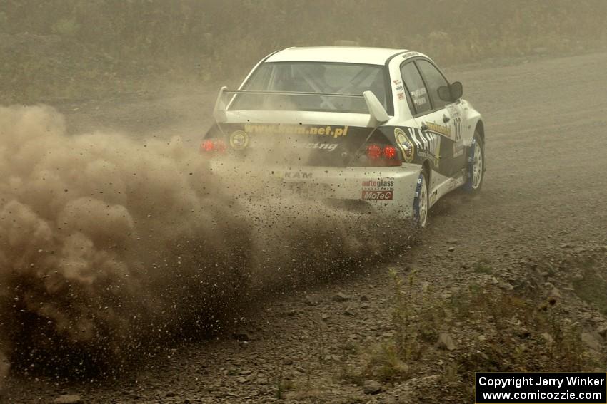 Andi Mancin / Maciej Wislawski power their Mitsubishi Evo 9 out of a 90-left on SS1.